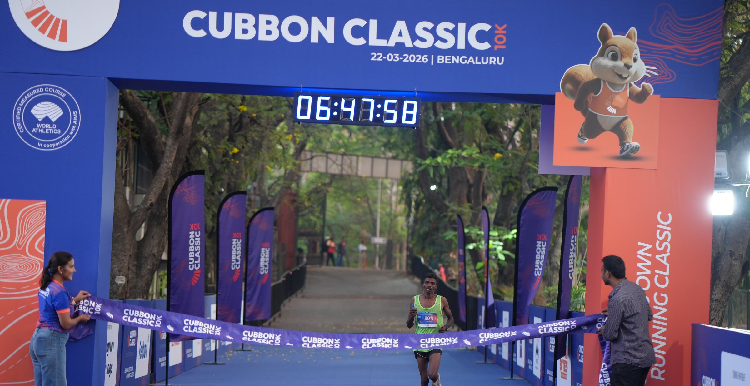 A runner breaking the Cubbon Classic finish tape